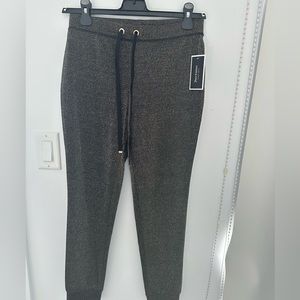 Juicy Couture Black & Gold Metallic Sweat Pant. New with tag on. Size: XS.